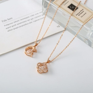 Detailed macro view of rose gold dolphin and knot pendants with shimmering zircon stones