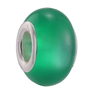 Detailed view of a green faux cat-eye glass charm bead with a silver metal core center