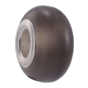 Macro view of a translucent grey-brown bead with a silver metal core for jewelry making