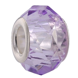 Macro shot of a faceted purple crystal bead with a silver metal core for DIY bracelets