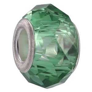 Macro detail of faceted green crystal bead with large silver metal core for DIY bracelets