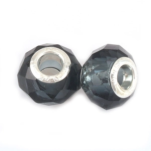 Macro shot of 925 sterling silver core facets on dark grey crystal DIY beads