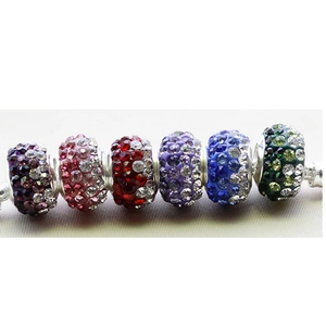 Macro shot of colorful Shamballa beads on a silver chain with pave crystal settings