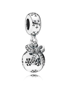 Detailed silver Christmas charm with snowflake patterns and a cubic zirconia bow