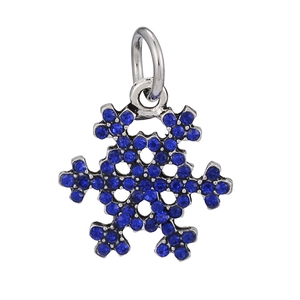 Macro shot of silver snowflake charm pendant featuring deep blue inlaid rhinestones