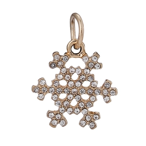 Detailed view of a gold snowflake pendant with white rhinestones and a top loop ring