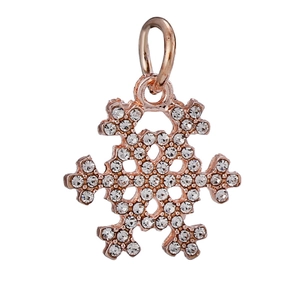 Macro shot of rose gold snowflake charm with pave-set rhinestones for jewelry making
