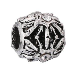 Macro view of vintage silver snowflake charm bead with rhinestones for DIY bracelets