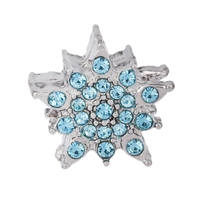 Detailed close-up of a snowflake pendant with sky blue cubic zirconia in silver setting