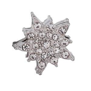 Close-up of a silver snowflake pendant bead with sparkling white rhinestones for DIY jewelry