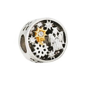 Macro shot of vintage silver charm with gold star and angel detail for DIY bracelets
