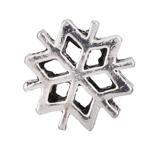 Macro detail of snowflake charm pendant with vintage hollow design for DIY jewelry