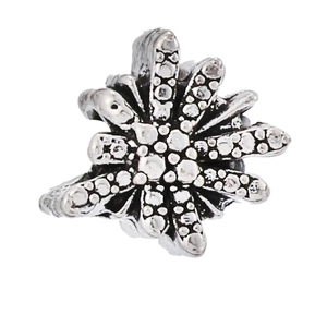 Detailed view of silver vintage snowflake charm with sparkling white zircon stones