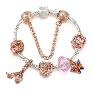 Detail of silver snake chain bracelet with rose gold charms and pink crystals