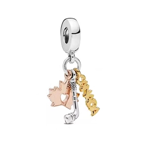 Three-piece dangle charm featuring maple leaf, hockey sticks, and Canada text element