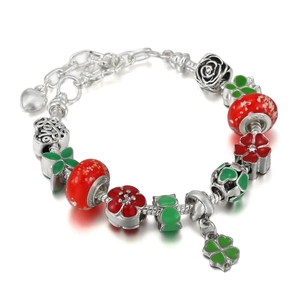 Detail of Christmas beaded bracelet with red enamel flowers and LOVE charm on silver chain