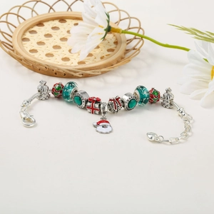 Detail of Christmas beaded bracelet with Santa charms and Forever Love engraving