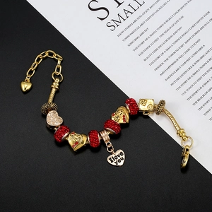 Gold beaded snake chain bracelet with red crystal charms and I Love You heart pendant