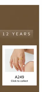 Detail of interlocking oval ring in golden finish on finger with sleek metal texture