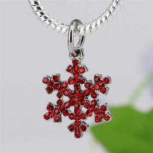 Sparkling silver snowflake pendant with red zircon stones on a snake chain
