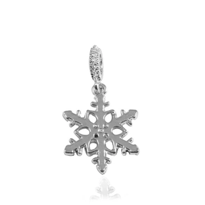 Macro shot of silver snowflake pendant with sparkling pavé cubic zirconia settings