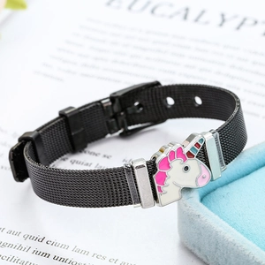 Macro view of adjustable black mesh stainless steel bracelet with enamel unicorn charm