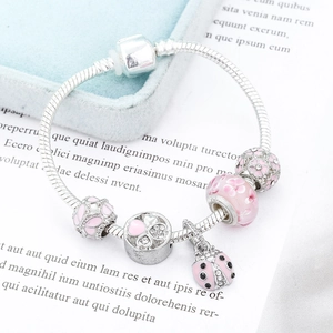 Silver snake chain bracelet with pink flower glass beads and ladybug charm
