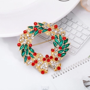 Christmas wreath brooch with green enamel leaves, red rhinestones and gold bells
