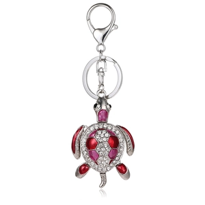 Lucky turtle keychain with red enamel shell and sparkling crystals on silver alloy