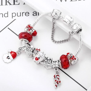 Christmas charm bracelet with Santa Claus and candy cane pendants on a silver snake chain