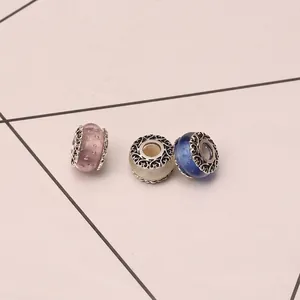 Three-color glass bubble charms with intricate silver hollow-carved metal end caps