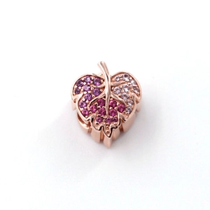 Detailed close-up of rose gold leaf charm with purple and pink gradient zircons