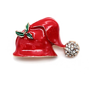 Broche bonnet de Noël en émail rouge et strass blancs sur une base en alliage doré