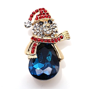 Detailed view of snowman brooch with blue teardrop crystal and sparkling rhinestones