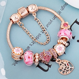 Bracelet arbre de vie or rose avec perles fleurs de cerisier roses et chaîne de sécurité