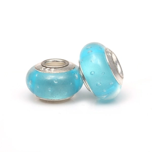 Macro detail of sky blue bubble glass beads with S925 sterling silver core and hallmark