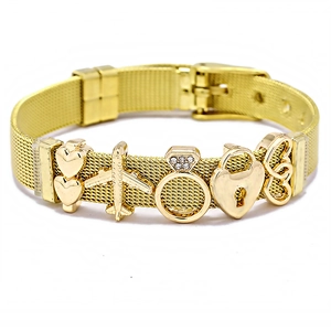 Gold mesh stainless steel bracelet with heart, plane, and diamond ring charms