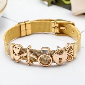 Detail of 10mm gold mesh watch band bracelet with heart and airplane charms