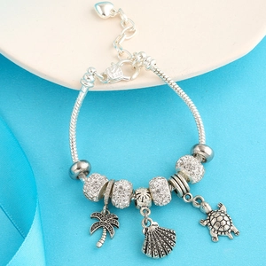 Silver plated heart charm bracelet with summer ocean themed coconut tree and turtle charms
