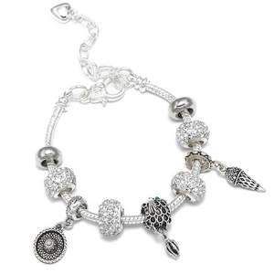 Detail of silver beaded bracelet featuring ice cream and sun hat charms with heart extender