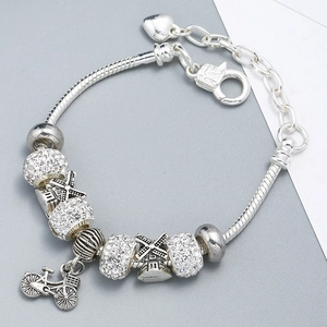 Silver charm bracelet with windmill and bicycle charms and heart extension chain