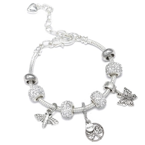 Macro view of silver butterfly and bee charms on a sparkling snake chain bracelet