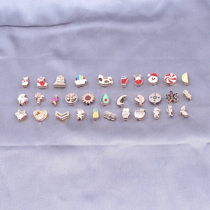 Mix of 32 rose gold enamel slider charms for DIY bracelets with various motifs