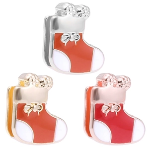 Detailed view of Christmas stocking charms in silver, gold, and rose gold for 10mm bracelets