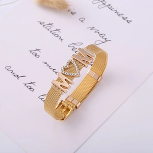 Gold mesh MOM bracelet with a crystal heart detail presented on a gift card