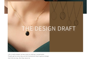 Detailed view of a gold beaded chain with an oval black gemstone pendant on a model