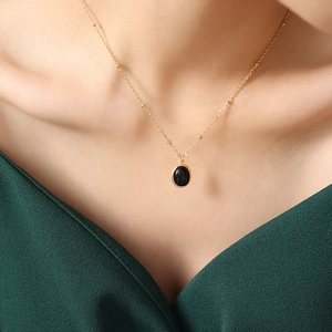Vintage light luxury titanium steel necklace with black opal pendant on gold beaded chain