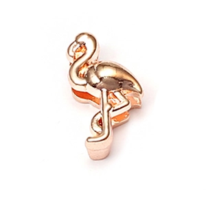 Detailed view of flamingo-shaped jewelry charm in polished rose gold finish