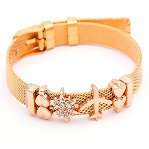 Gold mesh bracelet featuring heart charms, sparkling star pendant and a mini plane charm