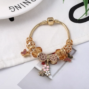 Goldenes Schlangenarmband mit rosa Schmetterlingen und Champagner-Kristallen